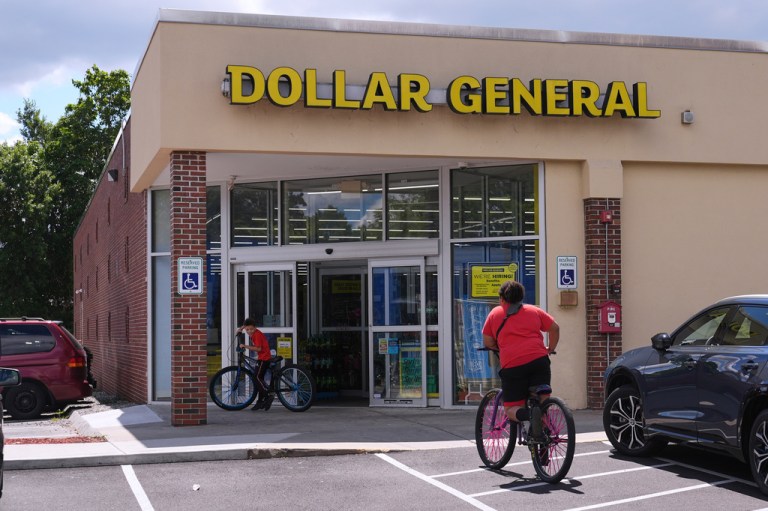 Children ride their bicycles to the Dollar General store.