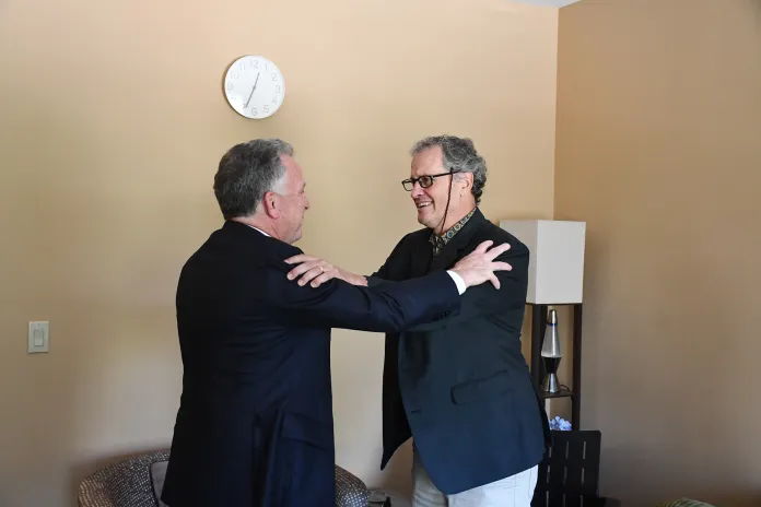 U.S. Envoy to the Middle East Steve Witkoff, left, and teacher Marc Fogel share an emotional embrace.