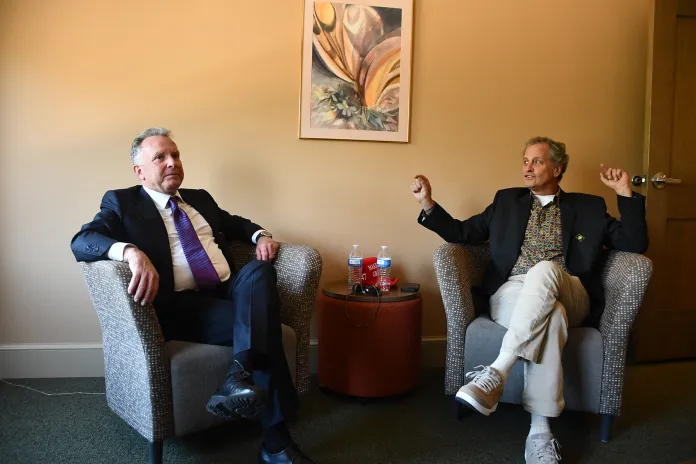 Steve Witkoff and Marc Fogel sit in chairs.