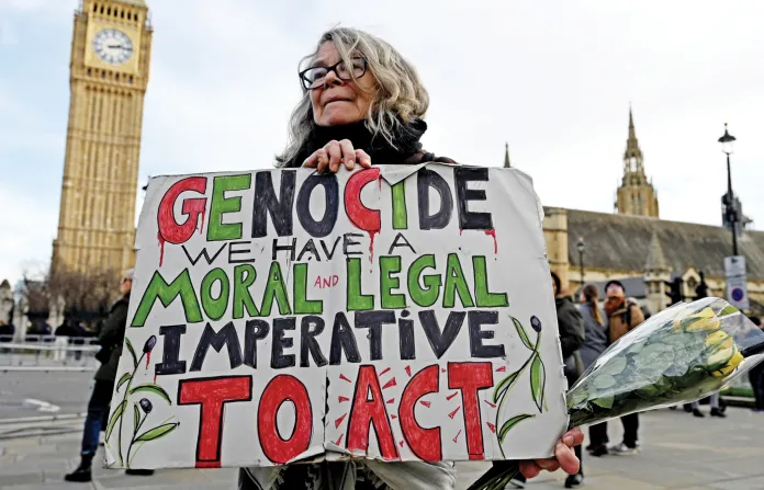 A sign lettered in Palestinian colors at a ‘Genocide Memorial Vigil’ in London’s Parliament Square, Jan. 24, 2026. (Rasid Necati Aslim/Anadolu/Getty)