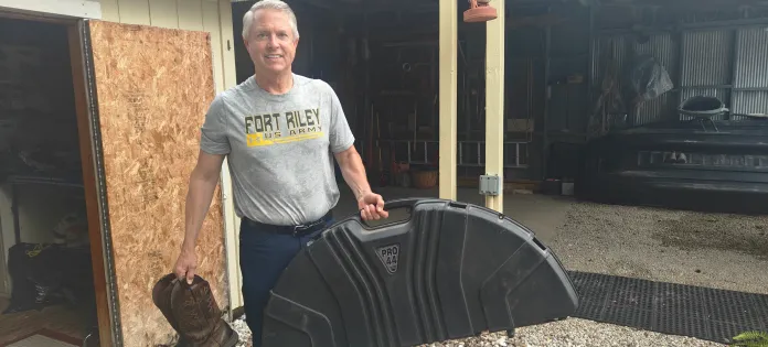 Marshall collects his bow from his childhood home in El Dorado, where his parents still live.