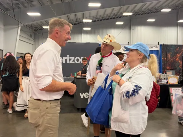 Rep. Rob Wittman (R-VA) talks to two voters