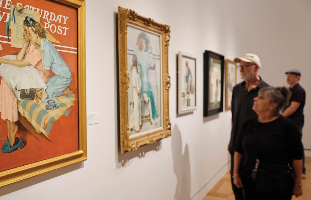 Visitors look at an exhibit in the Normal Rockwell section of the new Lucas Museum of Narrative Art on Sept. 22 in Los Angeles. (Ario Tama/Getty Images)