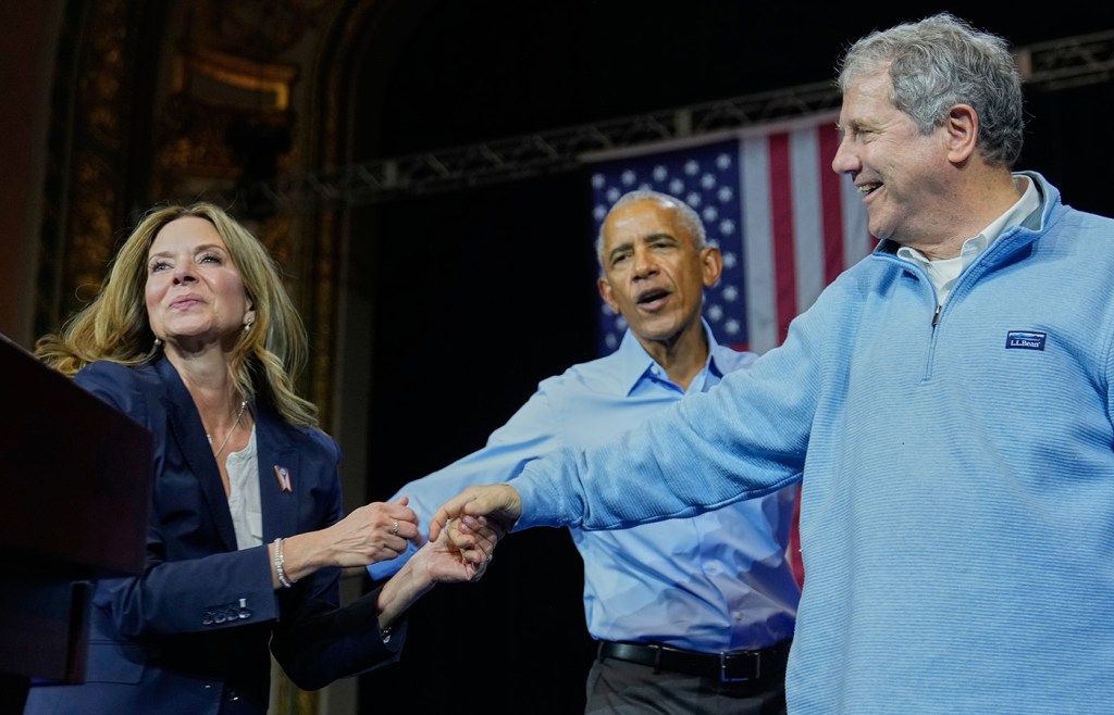Democratic Ohio gubernatorial candidate Amy Acton (left) former President Barack Obama (center), and Ohio Democratic Senate candidate Sherrod Brown (right) attend a campaign rally in Cleveland, Ohio, on Oct. 24. (Sue Ogrocki/AP)